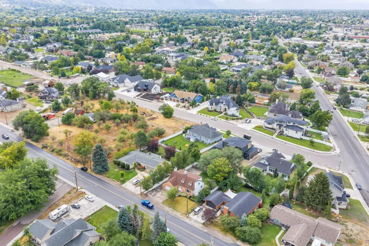 Expansive residential area featuring established homes, mature trees, and paved roadways