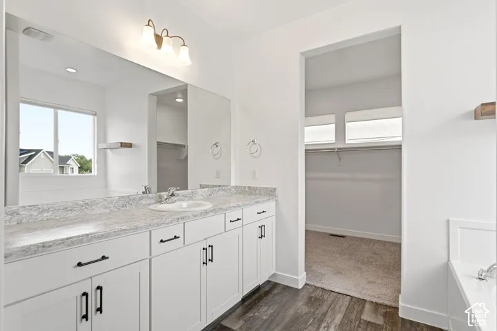 Dual vanity with an expansive countertop and under-mount sinks