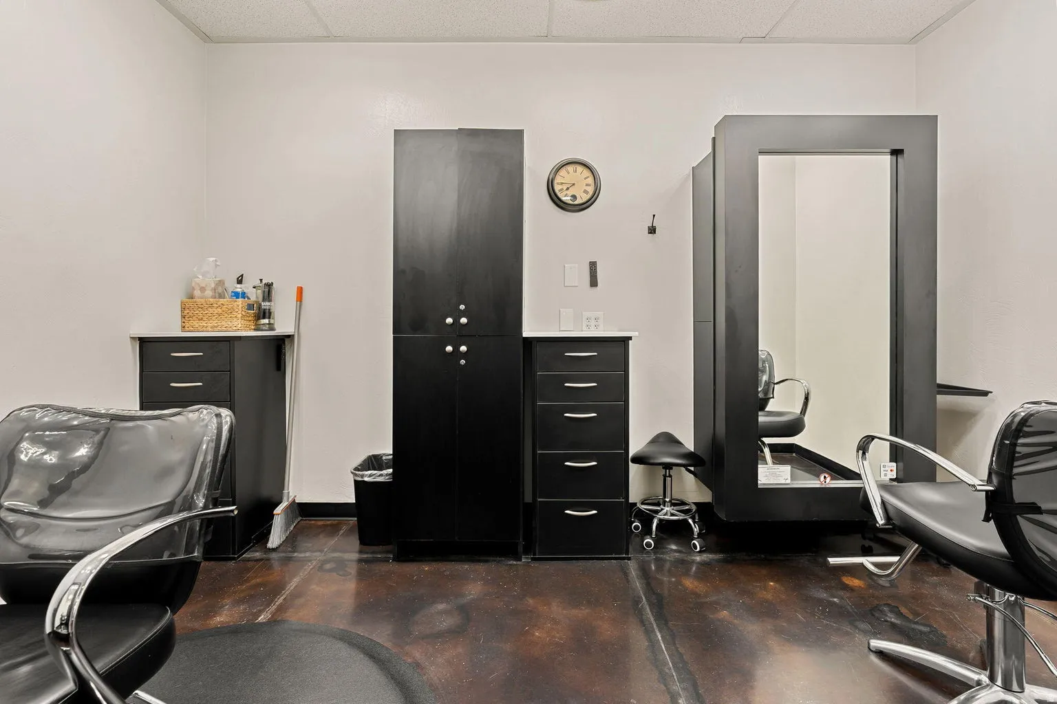 Hard-surface flooring, built-in cabinetry, and wall-mounted mirror with integrated shelving