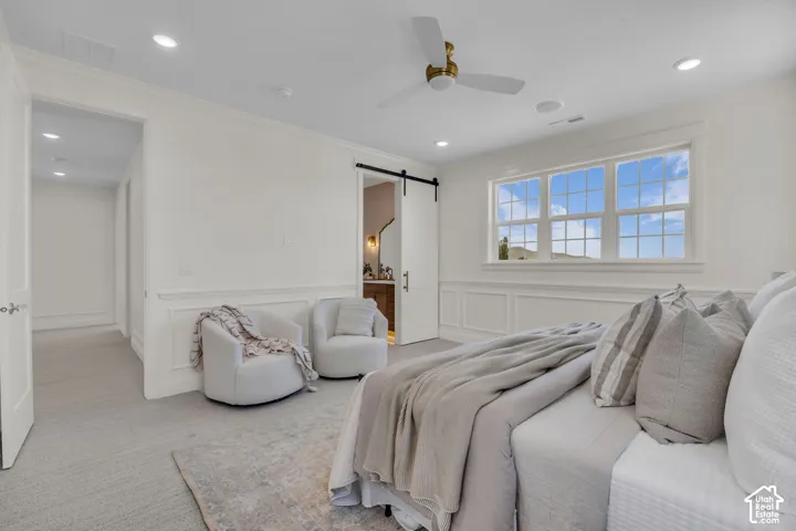 Wainscoting wall details, recessed lighting, and a ceiling fan with a gold-tone motor