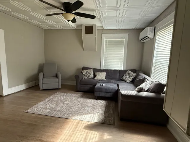 Wood-finish flooring with neutral wall tones and white trim