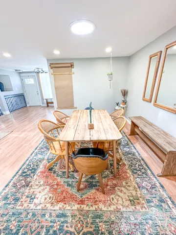 Wood-finish flooring throughout, recessed lighting, and a skylight