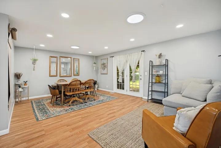 Wood-finish flooring throughout, recessed lighting, and a circular skylight