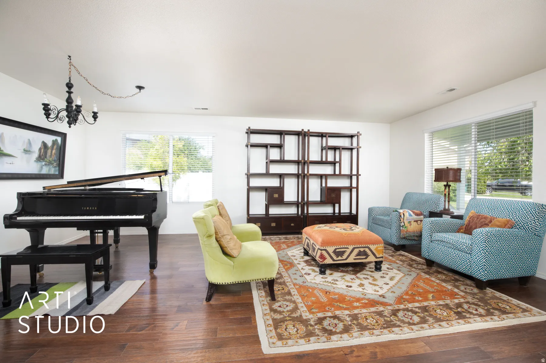 Hardwood-finish flooring, white walls, and a decorative dark wood shelving unit