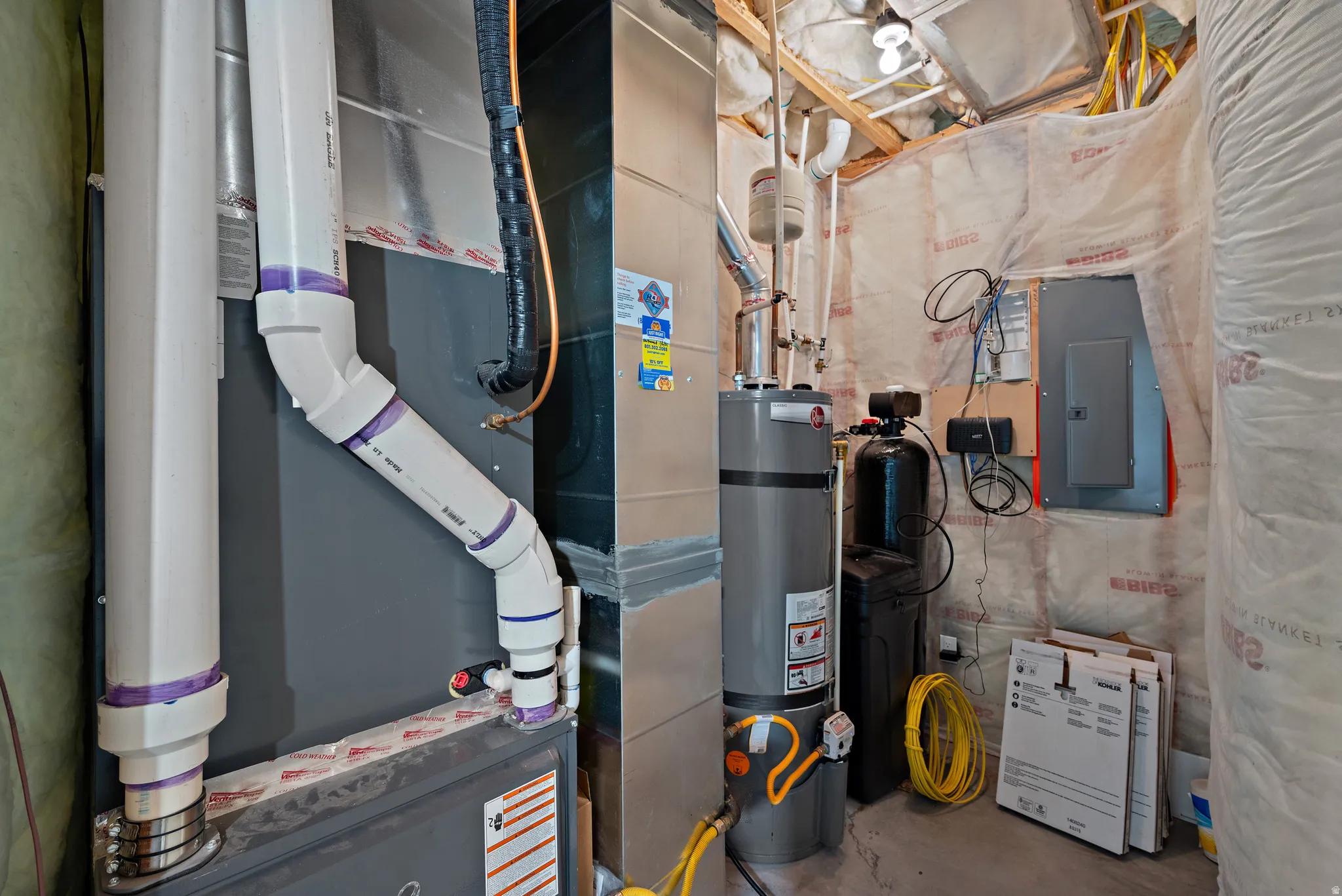 Forced-air furnace with PVC venting, water heater, and water filtration system
