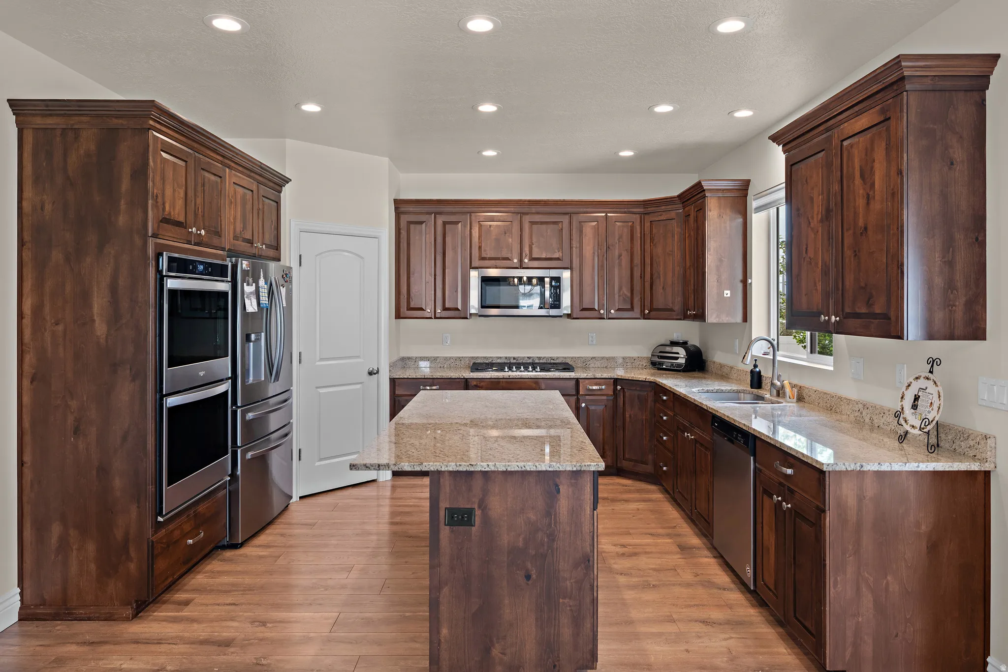 Wood-finish flooring complemented by extensive wood cabinetry