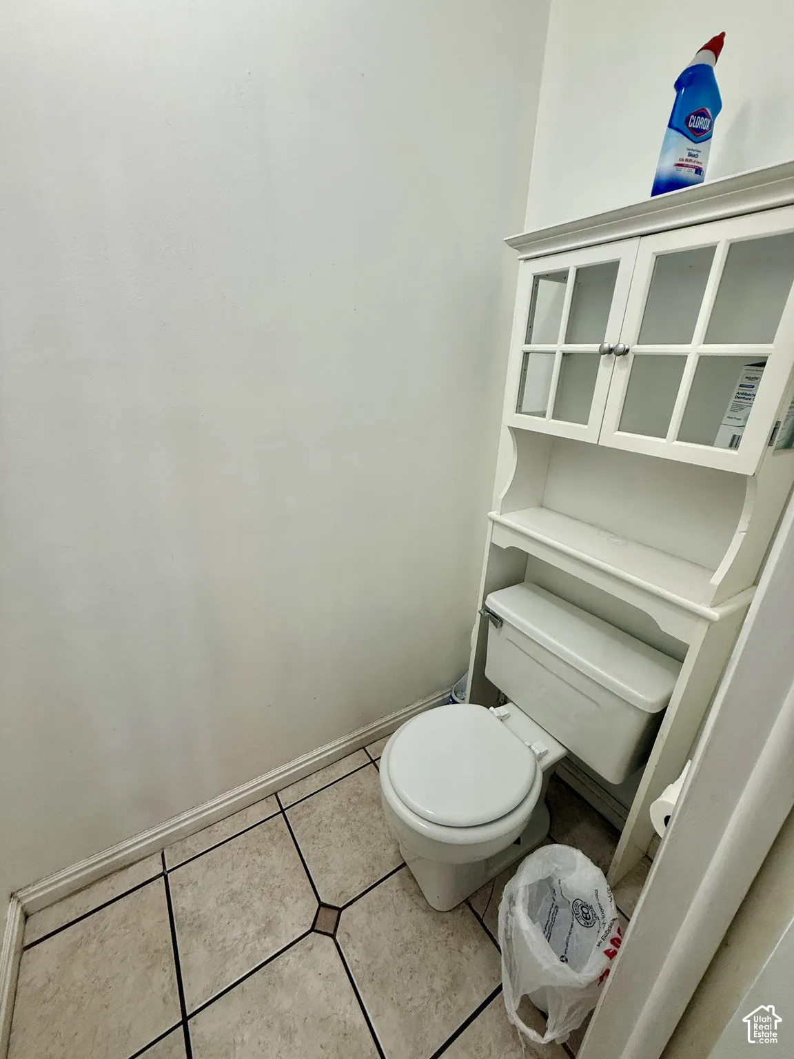 Tile flooring with decorative accents and a neutral color palette