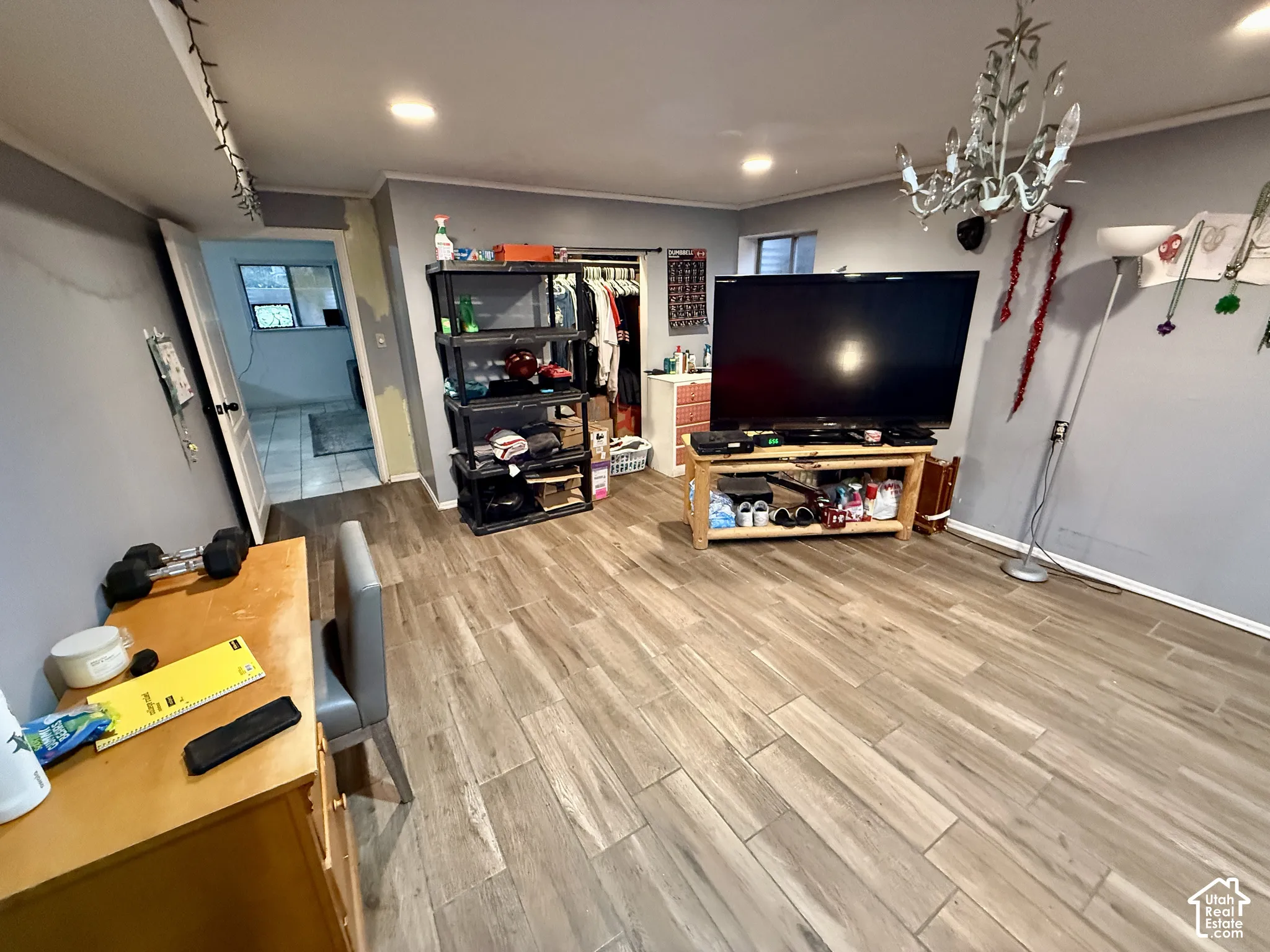 Wood-finish plank flooring throughout the space
