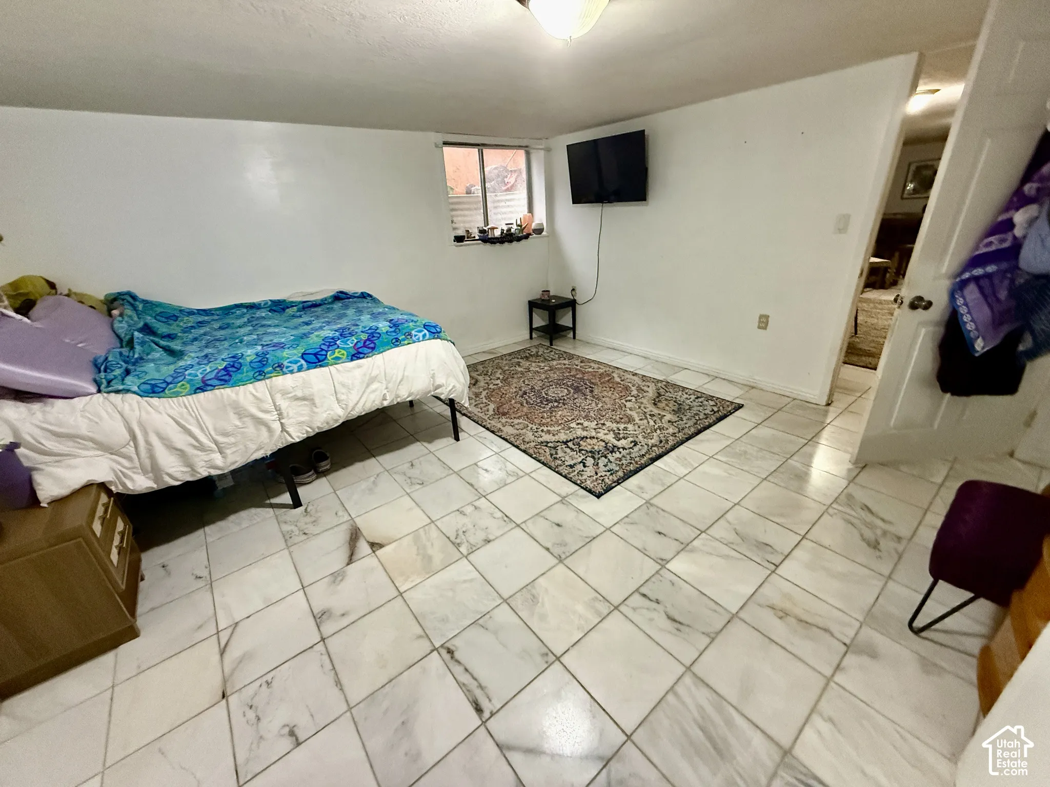 White tile flooring with a subtle veining pattern