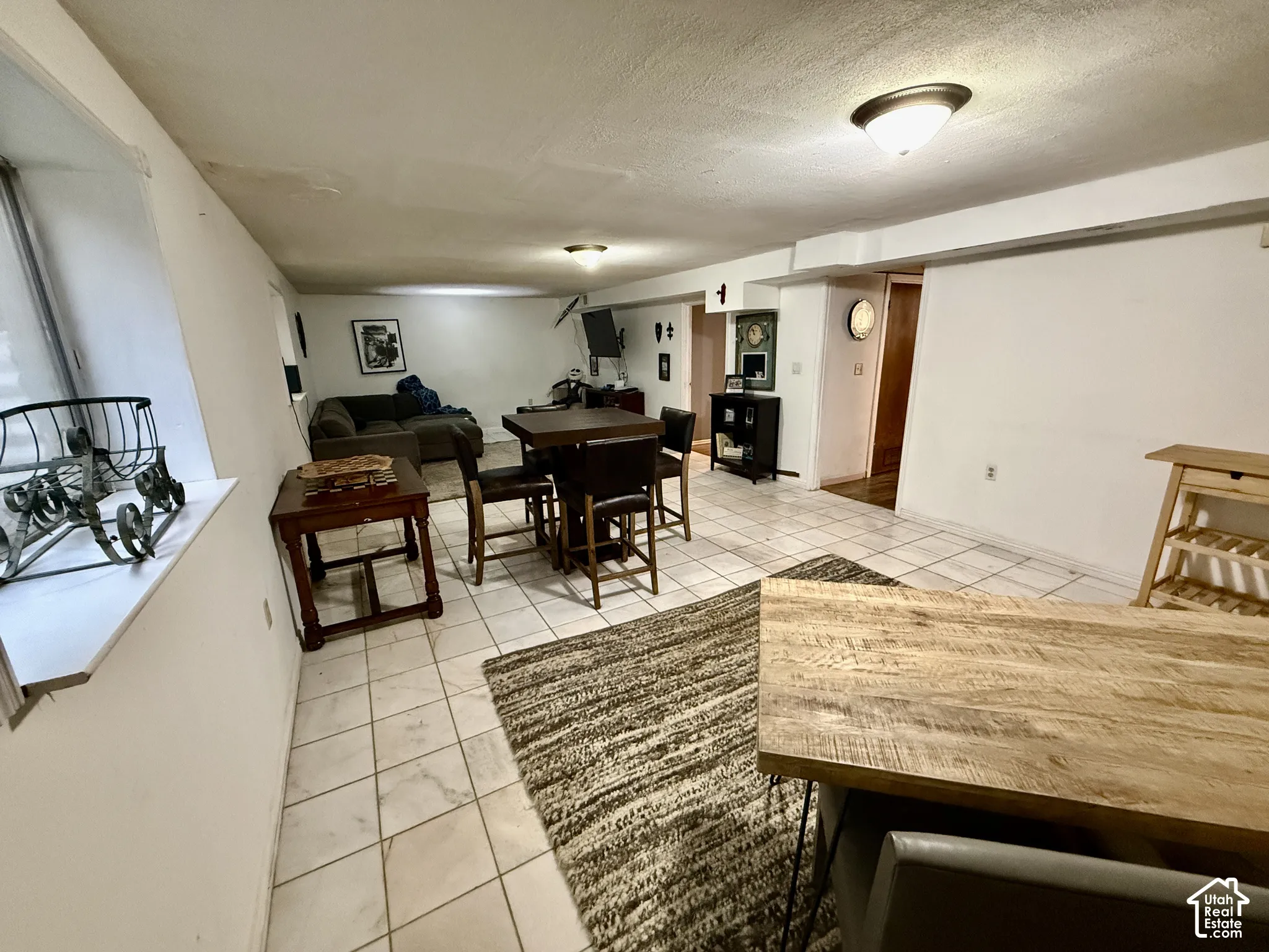 Spacious lower level offering tile flooring, recessed lighting, and a window to the left