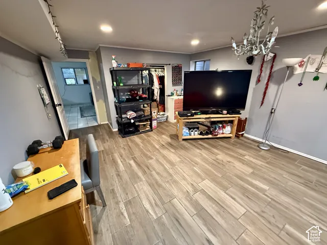 Wood-finish plank flooring throughout the space