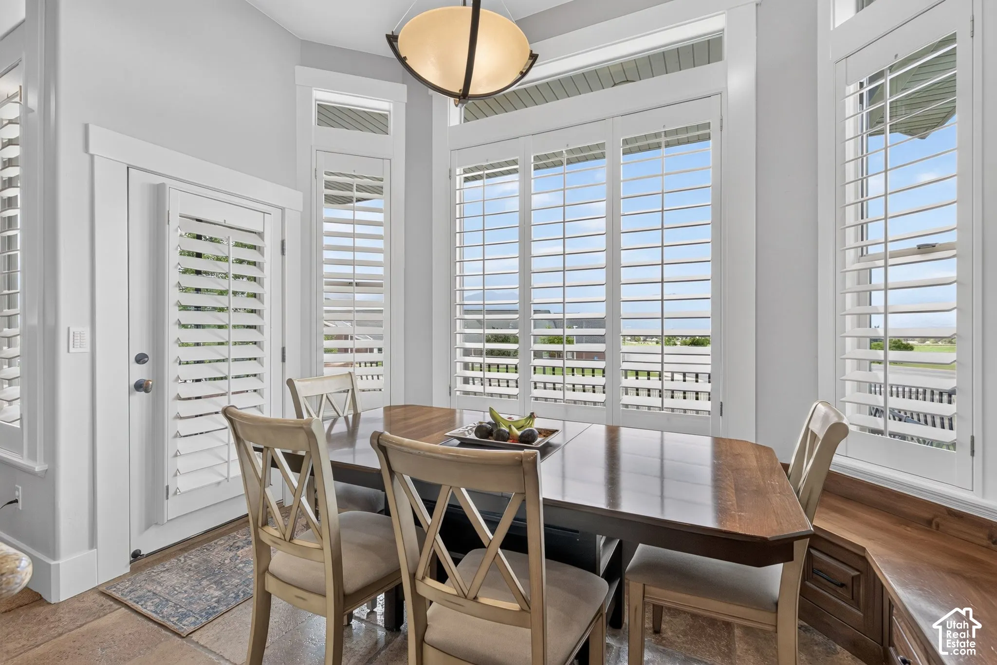 Bay window with plantation shutters and transom windows