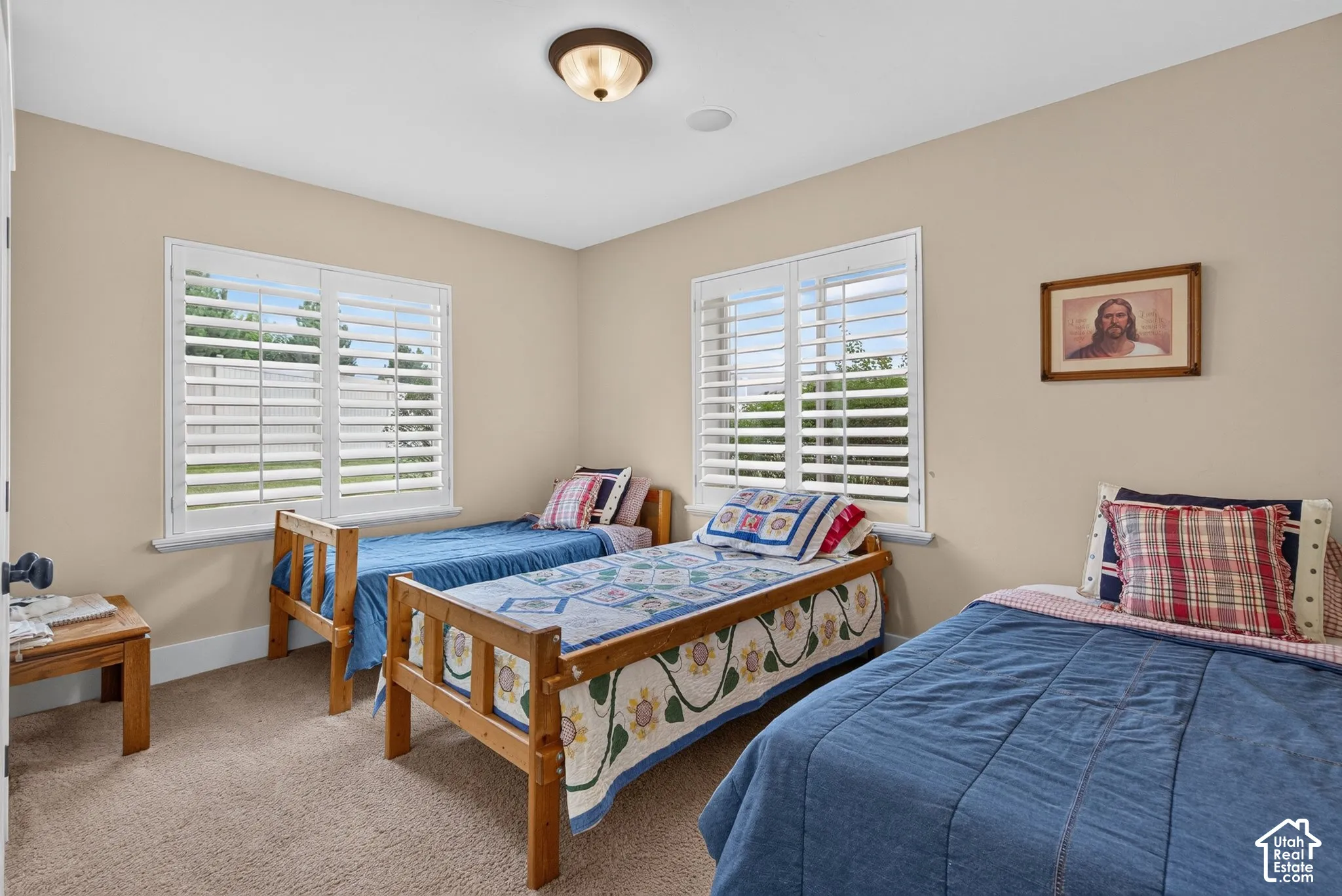 Neutral-toned walls complement plush carpet flooring