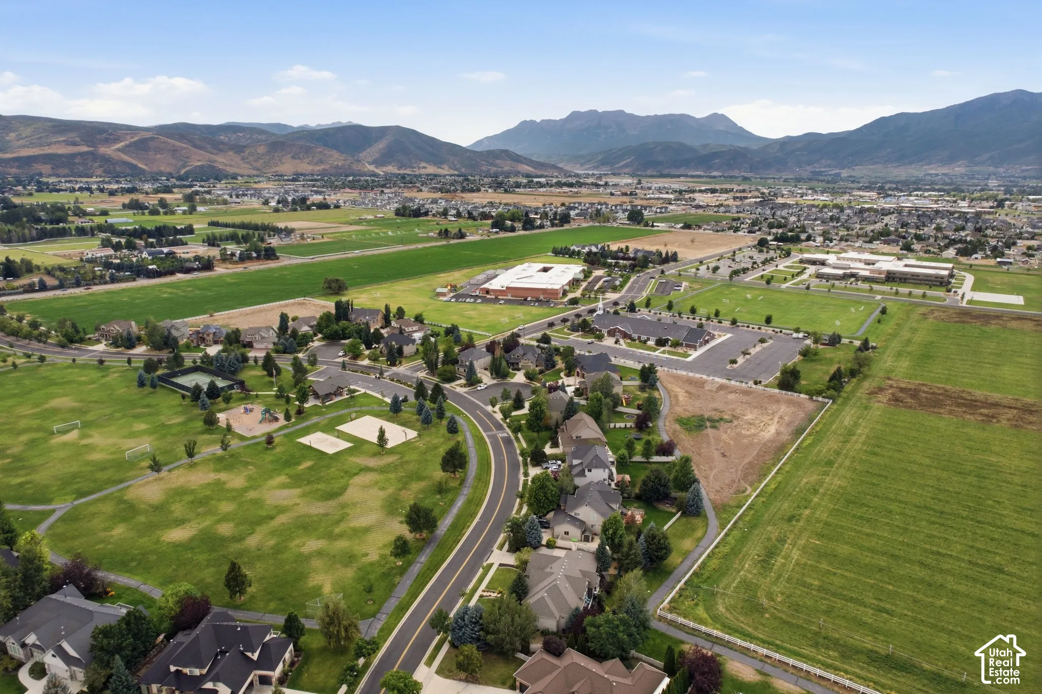 Expansive green spaces and mountain backdrop