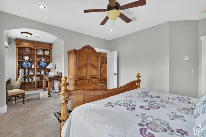 Carpeted flooring, recessed lighting, and a ceiling fan with integrated lighting
