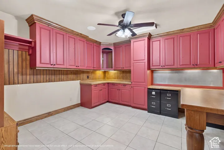 Virtually staged photo - removal of boxes, desks, chairs, and other personal items
