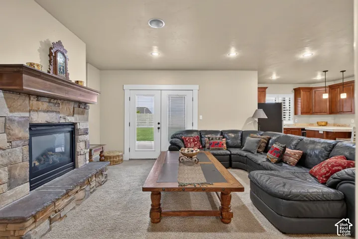 Stacked stone fireplace with a substantial wood mantel