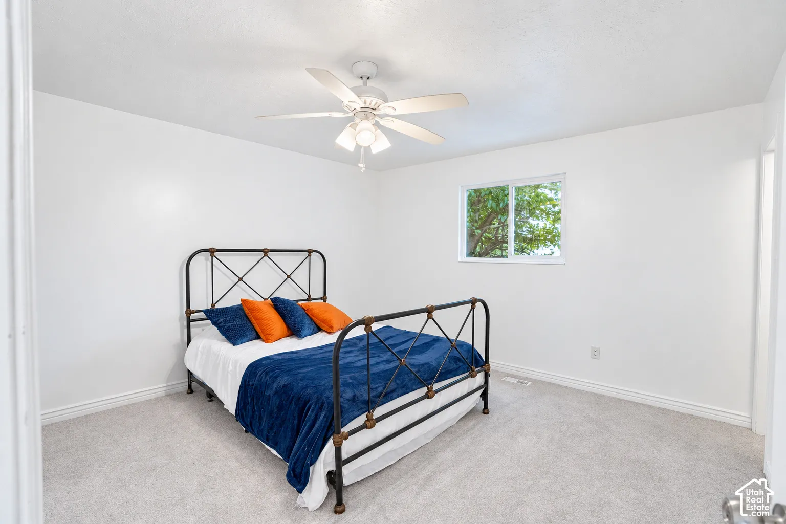Primary bedroom with walk in closet and remodeled 3/4 bath