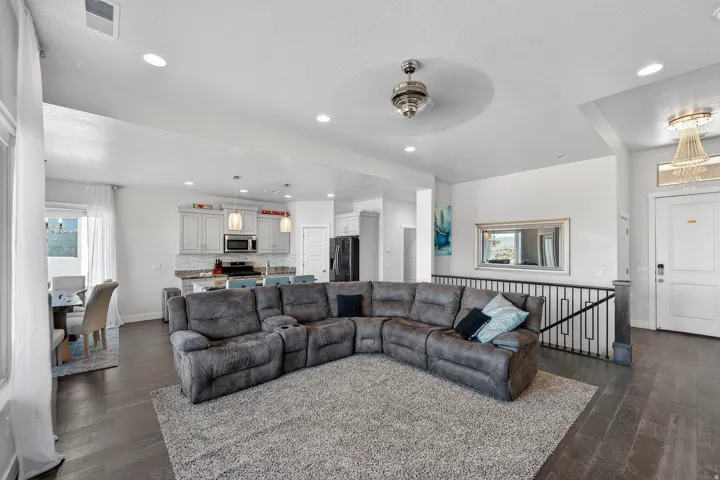 Open-concept living area with dark wood-finish flooring