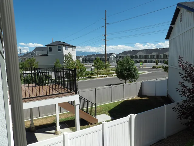 Elevated deck with composite decking and black metal railings