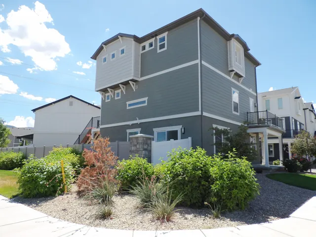 Modern multi-story exterior with horizontal siding and accent trim