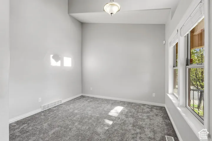 Recessed lighting, neutral paint palette, plush carpeting, multiple windows, window blinds