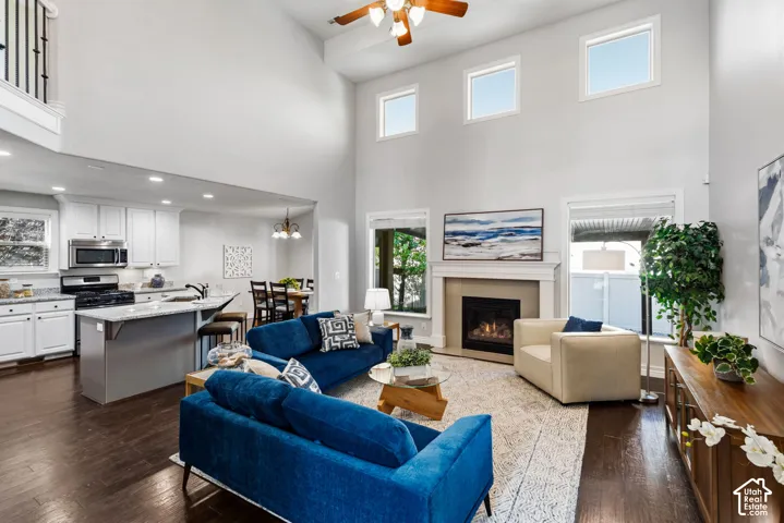 Two-story living area with a fireplace and large windows