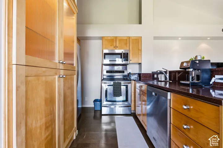 Wood cabinetry with upper glass-front elements