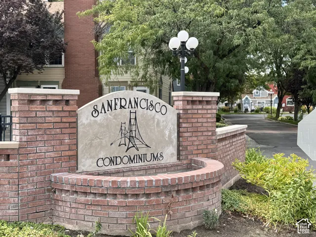 Brick entryway sign with a stone-finish plaque