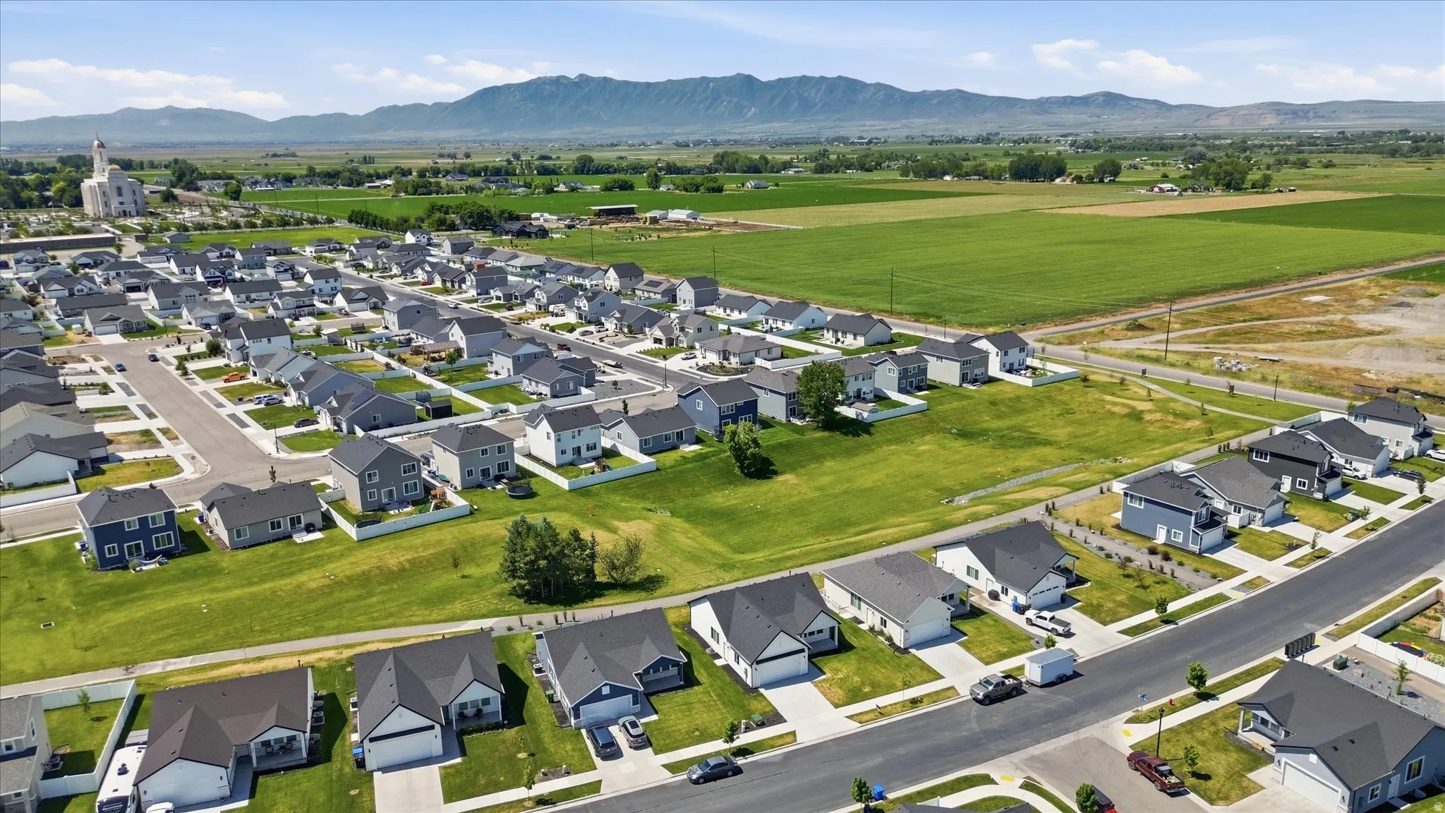 Suburban neighborhood featuring varied architectural styles and mature landscaping