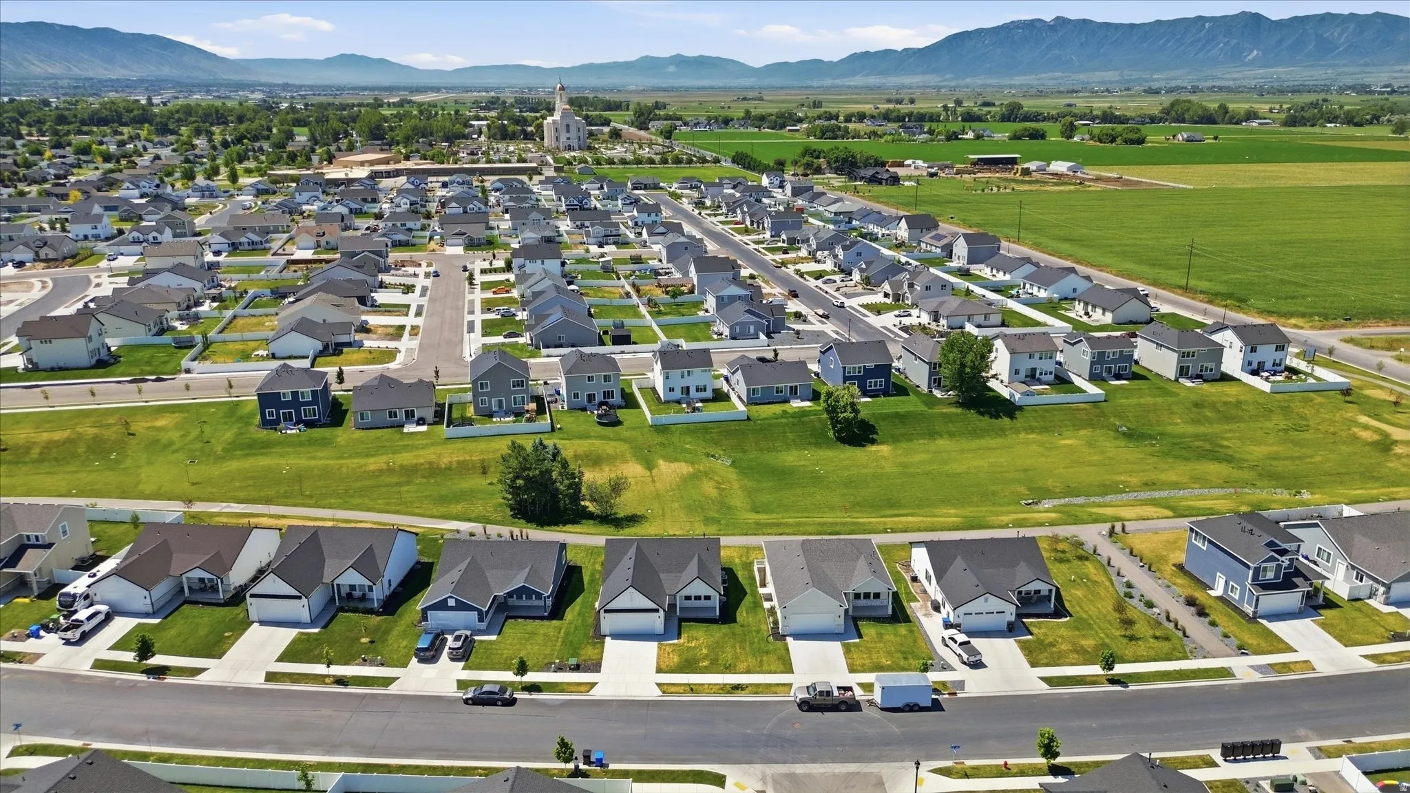 Newly constructed residential development featuring a structured street grid and established landscaping
