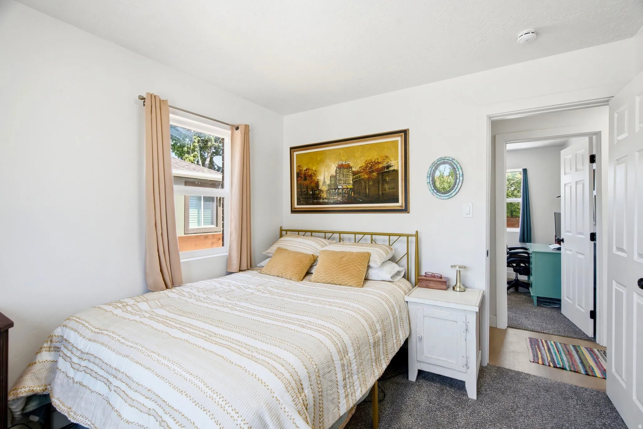 White painted walls with a window featuring a white frame