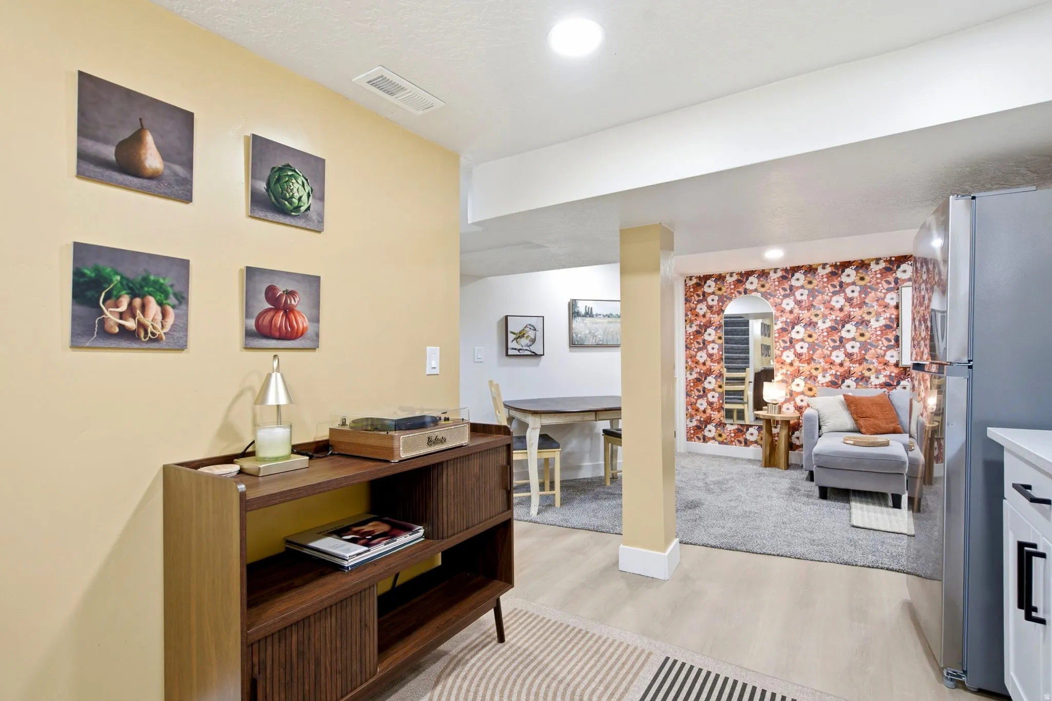 Light wood-finish flooring with recessed lighting