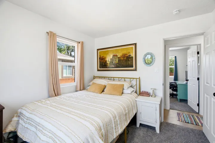 White painted walls with a window featuring a white frame