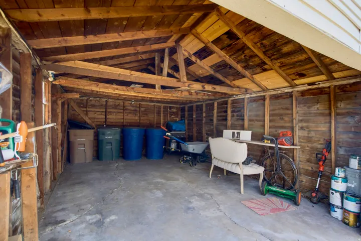 Exposed wood ceiling beams and wood wall paneling