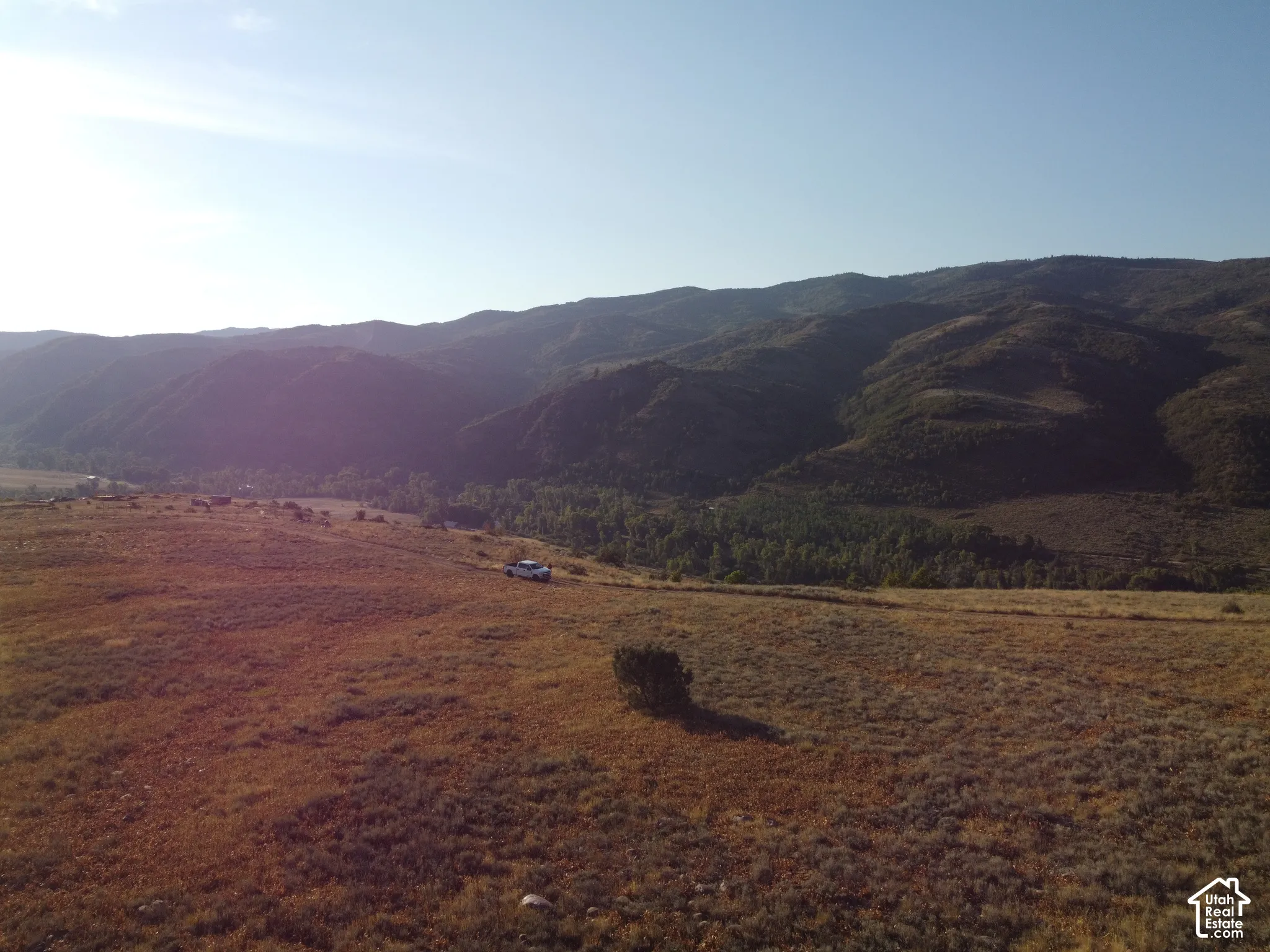 Expansive undeveloped land with a distant mountain backdrop