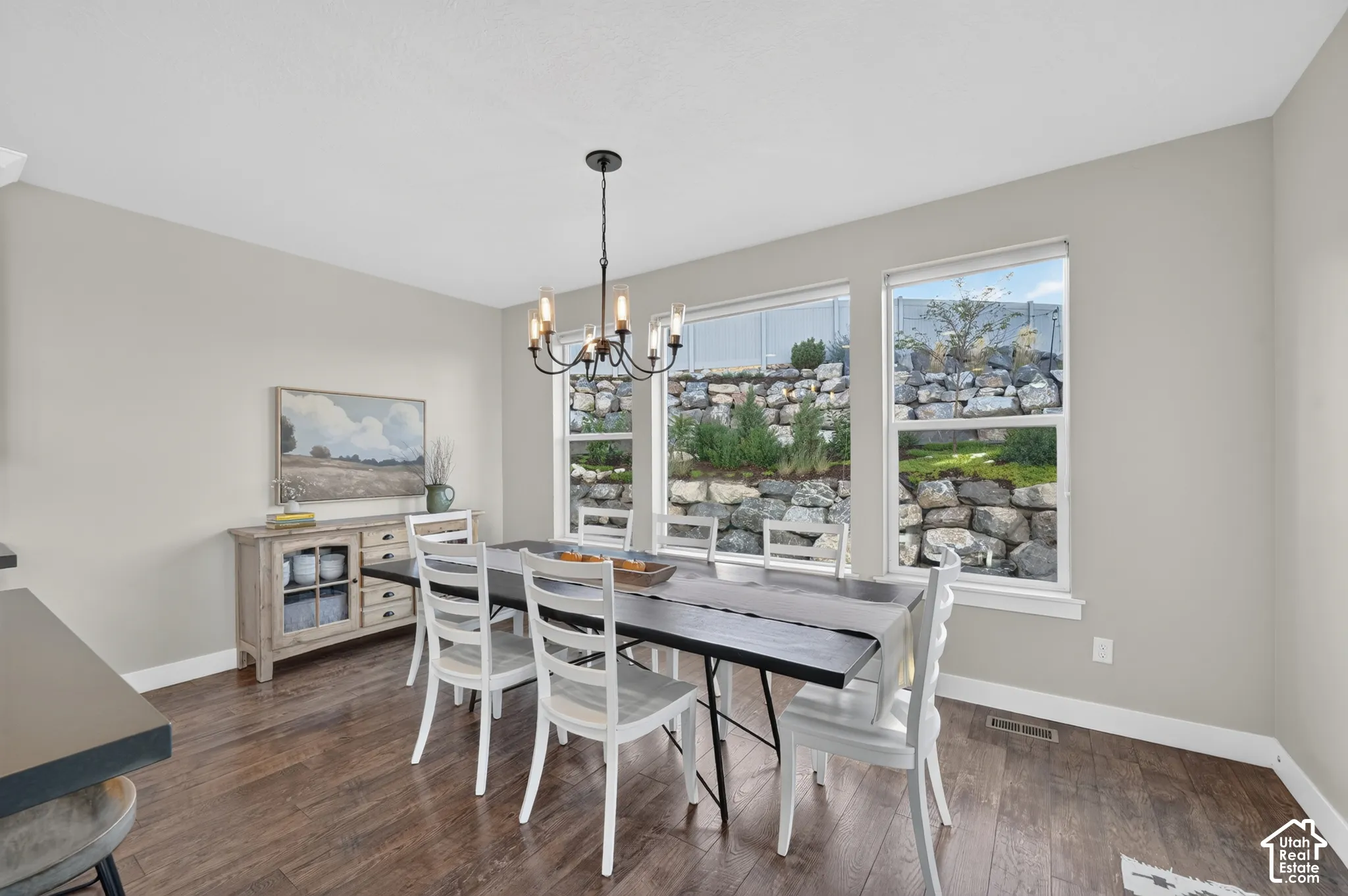 Warm wood-finish flooring complements light-toned walls