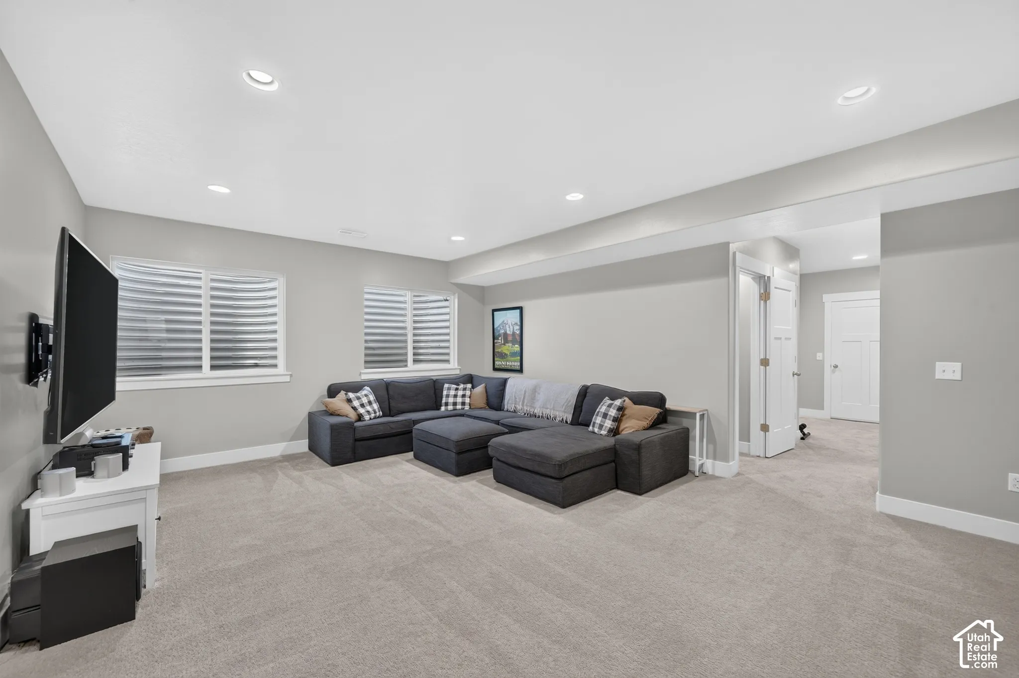Recessed lighting, light gray wall paint, white trim, and carpeted flooring