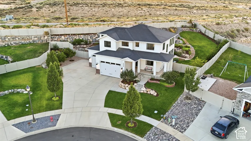 White two-story residence with a black shingle roof