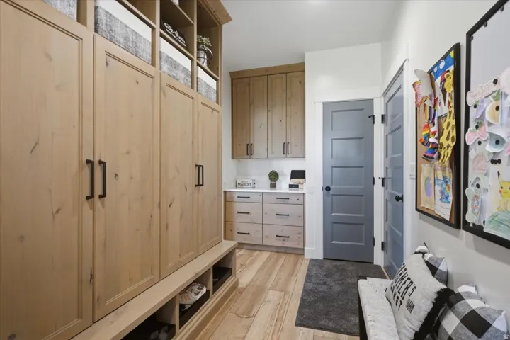 Custom cabinetry with open shelving and integrated storage