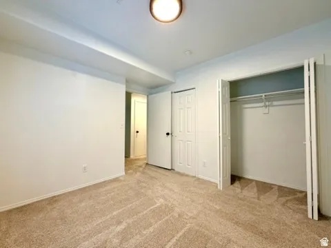 Neutral tone wall paint with a built-in closet featuring bi-fold doors