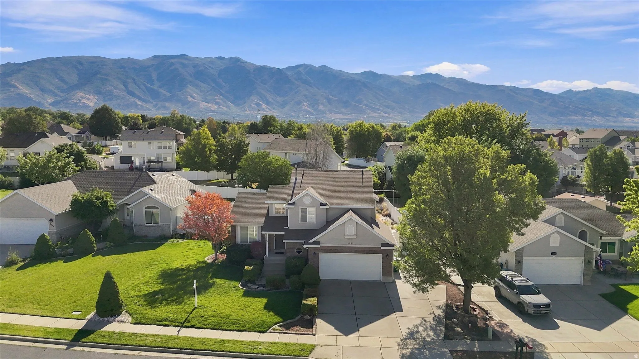 Stunning two-story residence situated on a generous lot with mature landscaping and manicured lawn