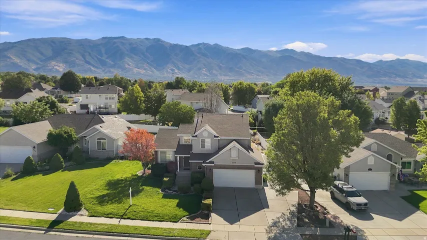 Stunning two-story residence situated on a generous lot with mature landscaping and manicured lawn