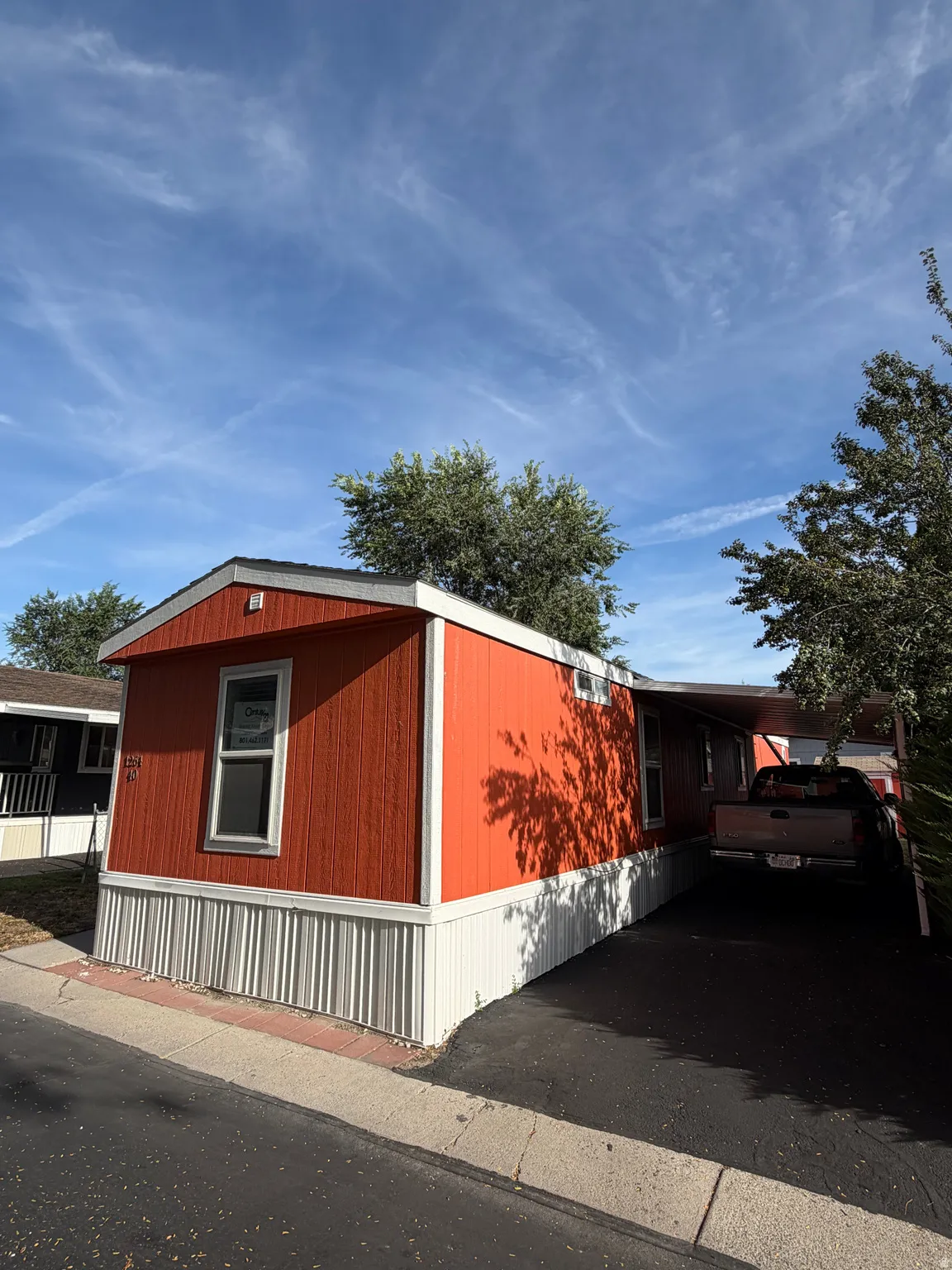 Red siding exterior with white trim