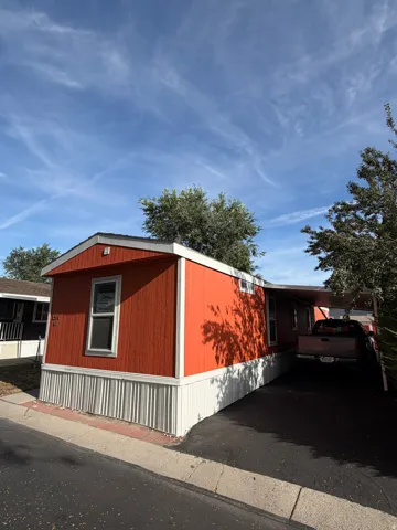 Red siding exterior with white trim
