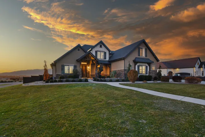 Stone and stucco exterior with dark trim accents