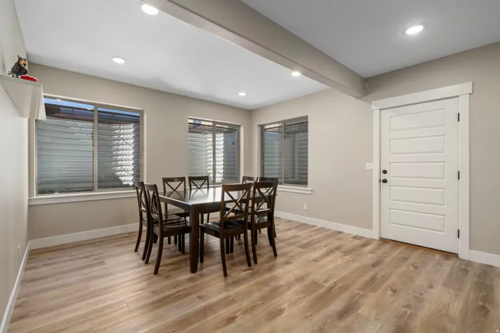 Recessed lighting, wood-finish flooring, and multiple windows