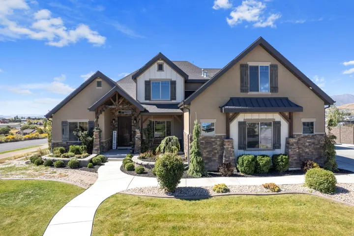 Stucco and stone exterior with board and batten accents