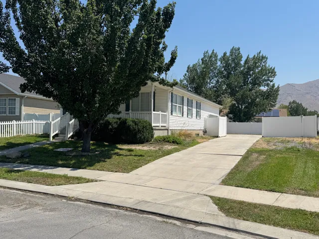 White siding exterior with window shutters and amazing covered front porch.