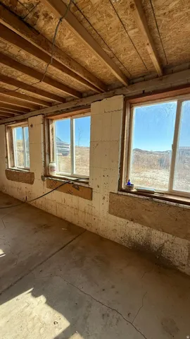 Exposed ceiling joists with oriented strand board subfloor